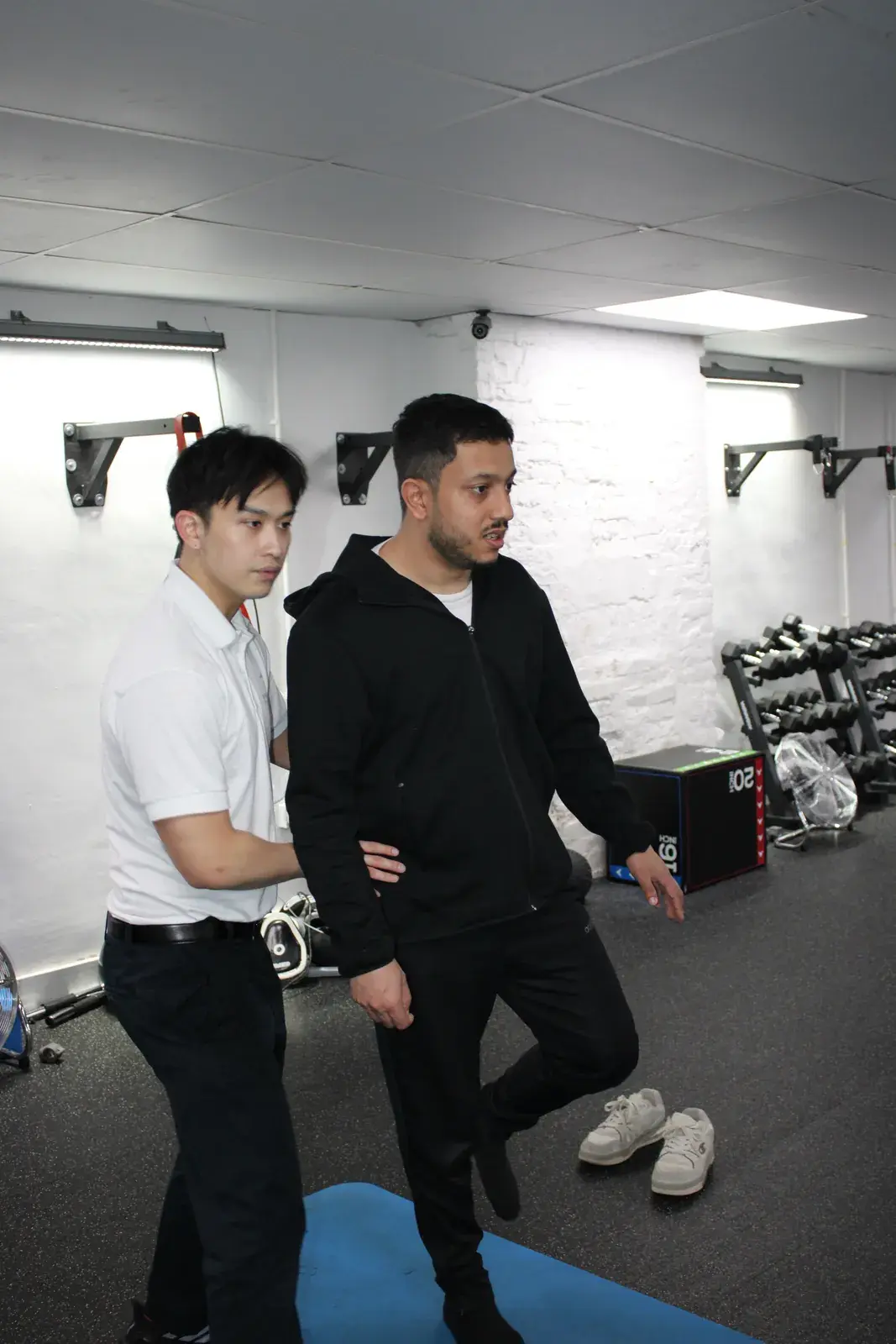 Guided single-leg movement drill in the gym