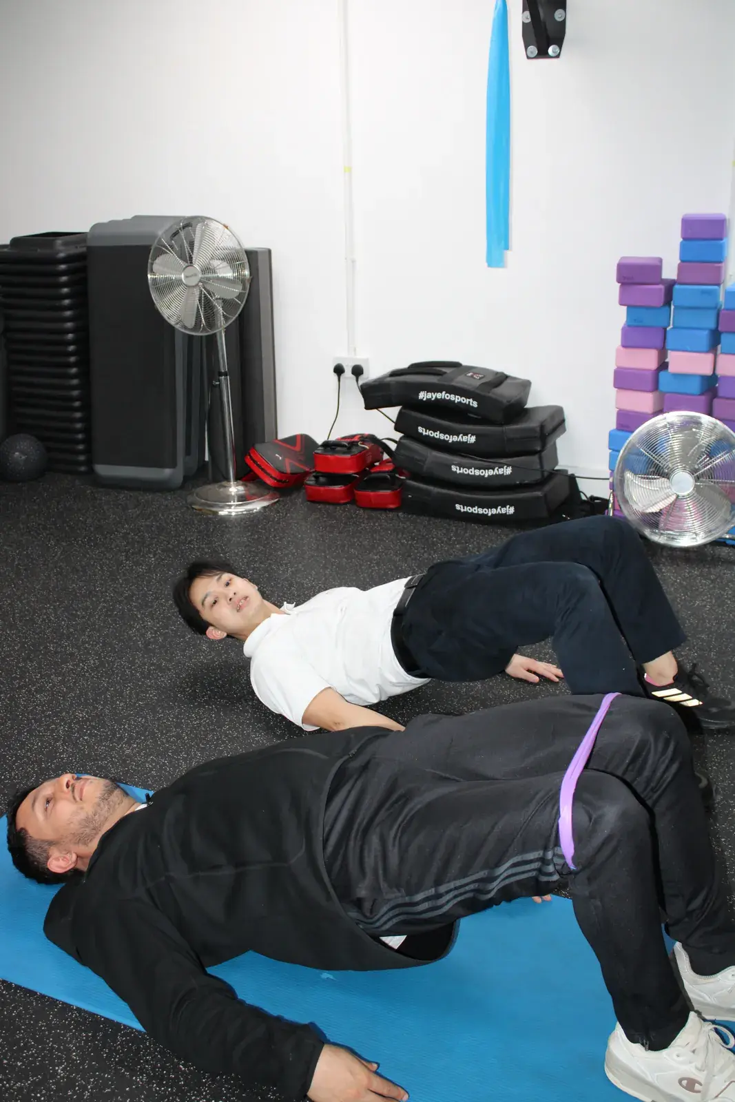 Floor exercise on mats in the studio at Archway Wellness Centre