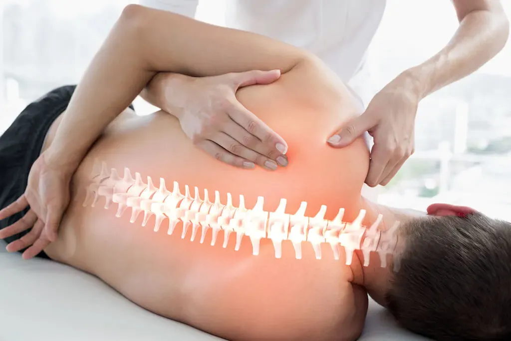 Registered osteopath treating a patient's spine at Archway Wellness Centre