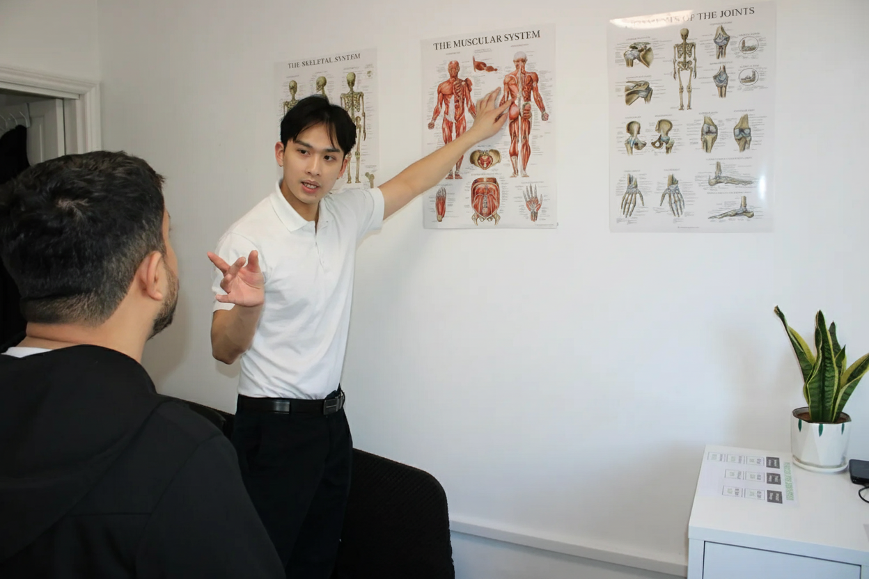 Osteopath explaining a diagnosis and treatment plan at Archway Wellness Centre